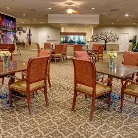 Settle into comfort at The Auberge at Sugar Land a room with tables and chairs