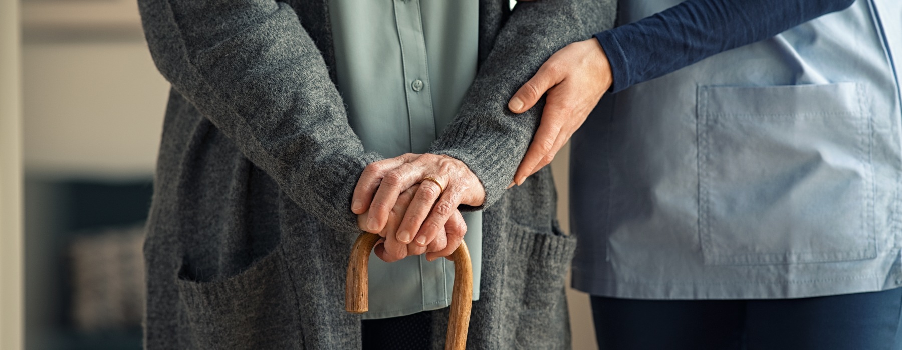 Nurse providing fall assistance to resident