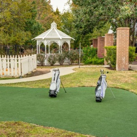 Settle into comfort at The Auberge at Sugar Land a putting green with a gazeebo in the back