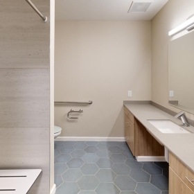 Spacious bathrooms with everything you need a bathroom with a sink and a mirror